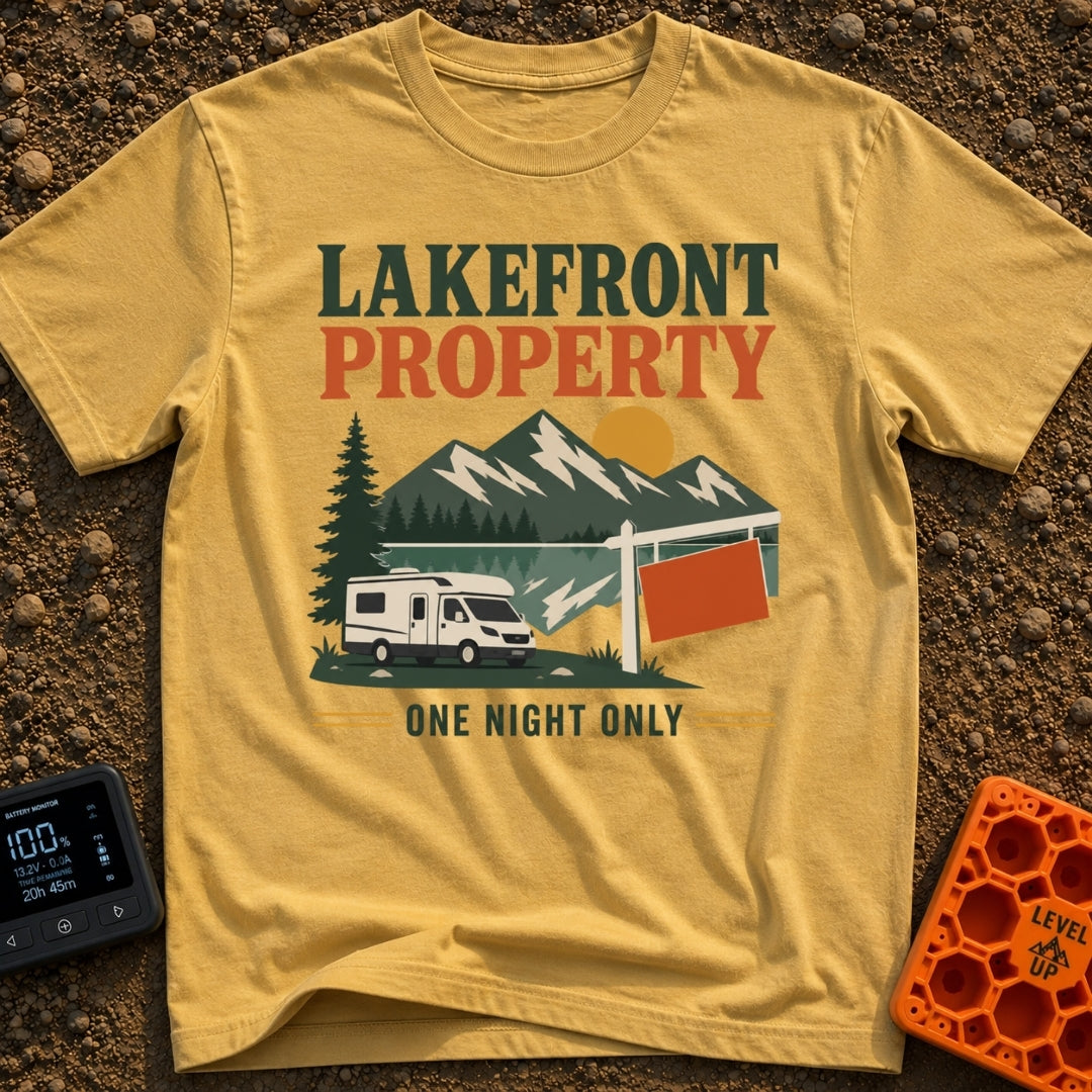 Overnight Lakefront Property - T-Shirt in Mustard - A graphic of a Class C motorhome parked next to a lake, pine trees,...