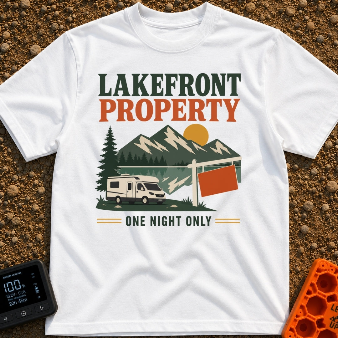 Overnight Lakefront Property - T-Shirt in White - A graphic of a Class C motorhome parked next to a lake, pine trees, and...