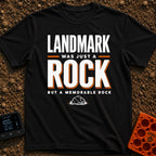 Just A Glorified Rock - T-Shirt in Black - A typographic design reading "LANDMARK WAS JUST A ROCK BUT A MEMORABLE ROCK"...
