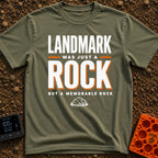 Just A Glorified Rock - T-Shirt in Moss - A typographic design reading "LANDMARK WAS JUST A ROCK BUT A MEMORABLE ROCK"...