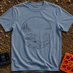Launch Before Coffee Cools - T-Shirt in Blue Jean - A line-art illustration inside a circle showing a folded drone, a...