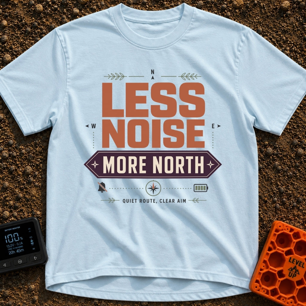 Less Noise More North - T-Shirt in Chambray - A typographic design featuring the text "LESS NOISE" in large orange...