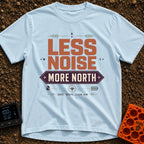 Less Noise More North - T-Shirt in Chambray - A typographic design featuring the text "LESS NOISE" in large orange...