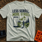 Stroll Over Scroll - T-Shirt in Bay - A graphic showing a large smartphone dissolving into square pixels on the left,...