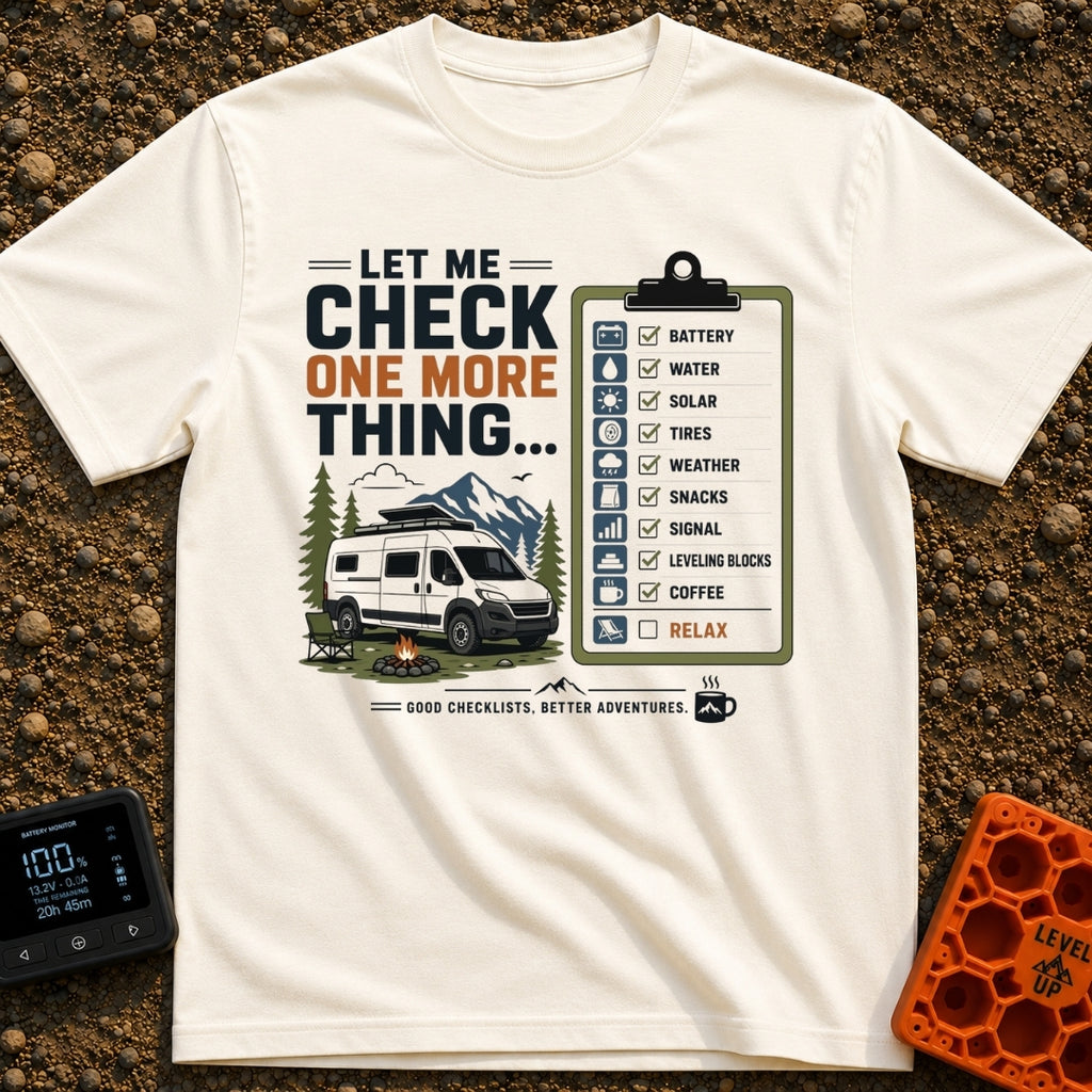 Just One More Check - T-Shirt in Ivory - A graphic featuring a white camper van parked by a campfire and camp chair with...