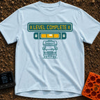 Finally Level Complete - T-Shirt in Chambray - A graphical design featuring a teal sign with yellow text reading 'LEVEL...
