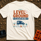 Level Headed Nomad - T-Shirt in Ivory - A typographic graphic reading "LEVEL GROUND CLEAR MIND" featuring a blue camper...