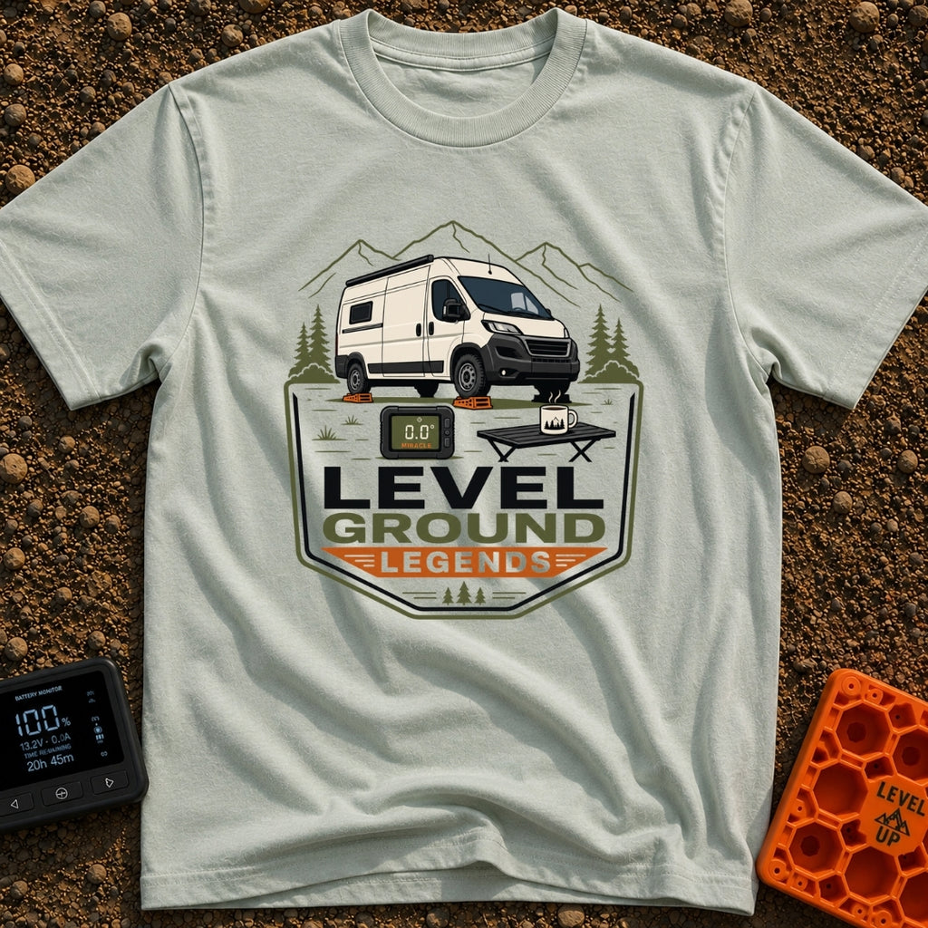Level Ground Legends - T-Shirt in Bay - A white camper van parked on orange leveling blocks in front of mountains and...