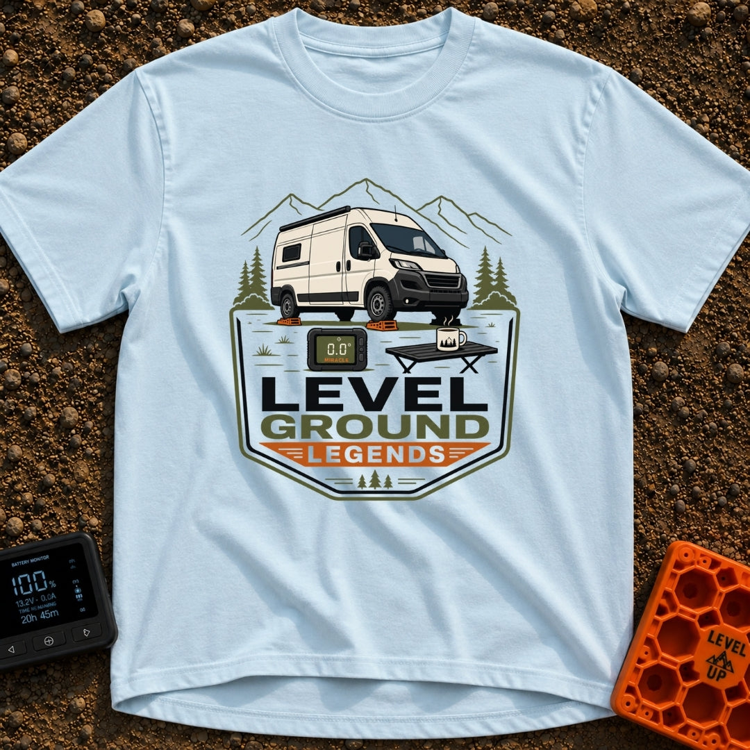 Level Ground Legends - T-Shirt in Chambray - A white camper van parked on orange leveling blocks in front of mountains...