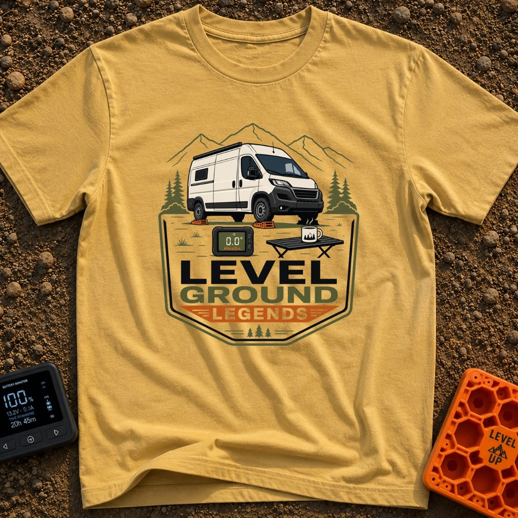 Level Ground Legends - T-Shirt in Mustard - A white camper van parked on orange leveling blocks in front of mountains and...