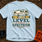 Level Is A Spectrum - T-Shirt in Chambray - A graphic of a vintage Class A motorhome parked on top of a large yellow...
