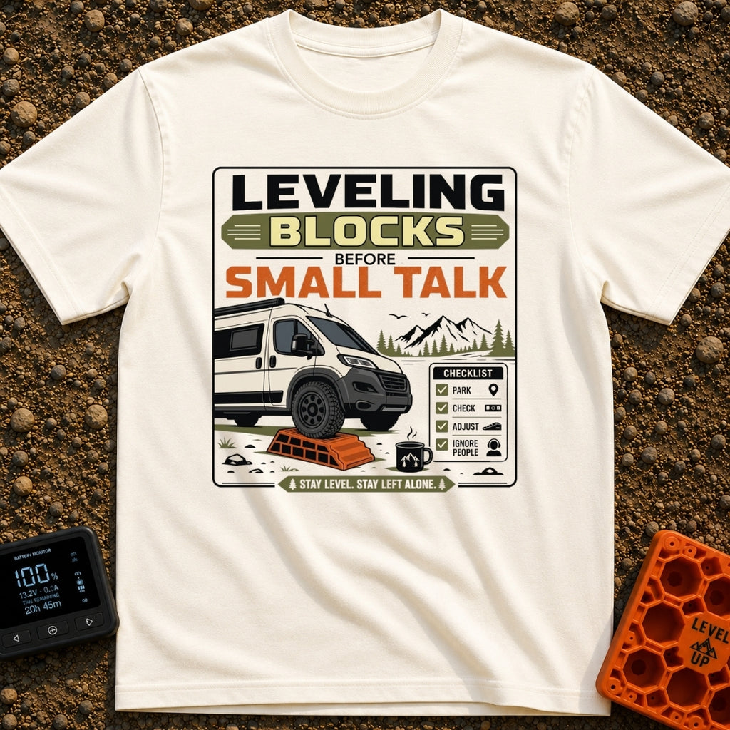 Leveling Before Small Talk - T-Shirt in Ivory - A graphic featuring a camper van parked with its front wheel on an orange...