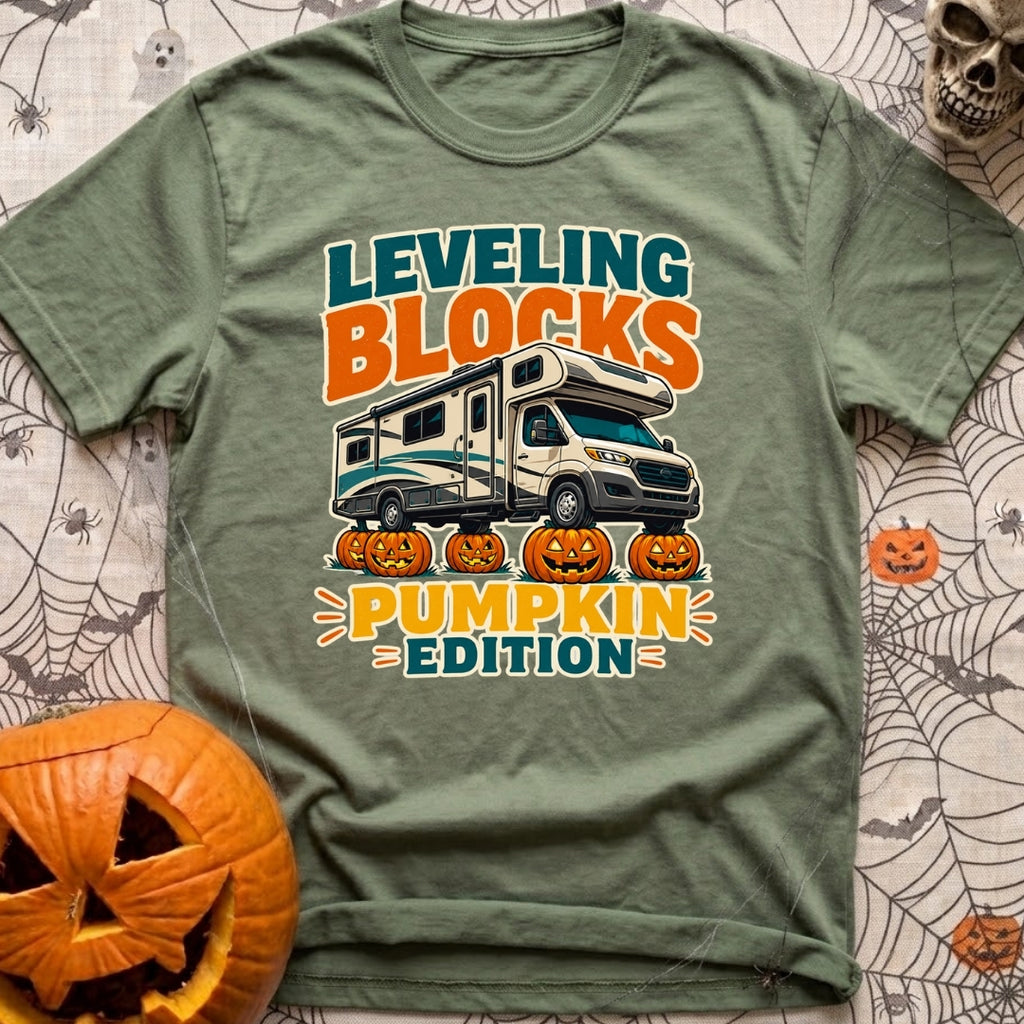 Pumpkin Spice Leveling - T-Shirt in Moss - A graphic showing a Class C motorhome parked with its tires resting on top of...