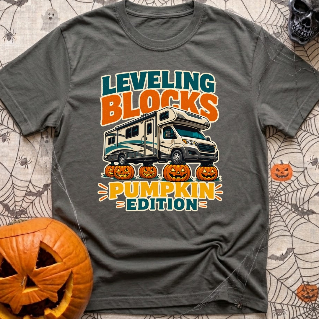 Pumpkin Spice Leveling - T-Shirt in Pepper - A graphic showing a Class C motorhome parked with its tires resting on top...