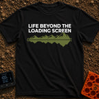 Outside Is Loading - T-Shirt in Black - The design features the text "LIFE BEYOND THE LOADING SCREEN" above a green...