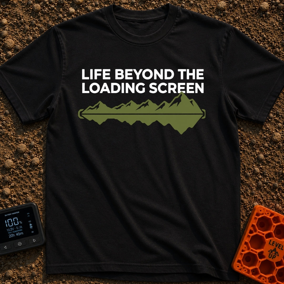 Outside Is Loading - T-Shirt in Black - The design features the text "LIFE BEYOND THE LOADING SCREEN" above a green...