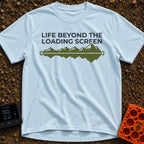 Outside Is Loading - T-Shirt in Chambray - The design features the text "LIFE BEYOND THE LOADING SCREEN" above a green...