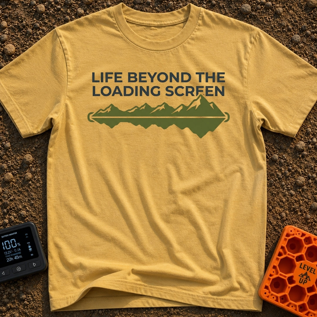 Outside Is Loading - T-Shirt in Mustard - The design features the text "LIFE BEYOND THE LOADING SCREEN" above a green...