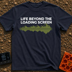 Outside Is Loading - T-Shirt in Navy - The design features the text "LIFE BEYOND THE LOADING SCREEN" above a green...