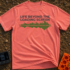 Outside Is Loading - T-Shirt in Watermelon - The design features the text "LIFE BEYOND THE LOADING SCREEN" above a green...