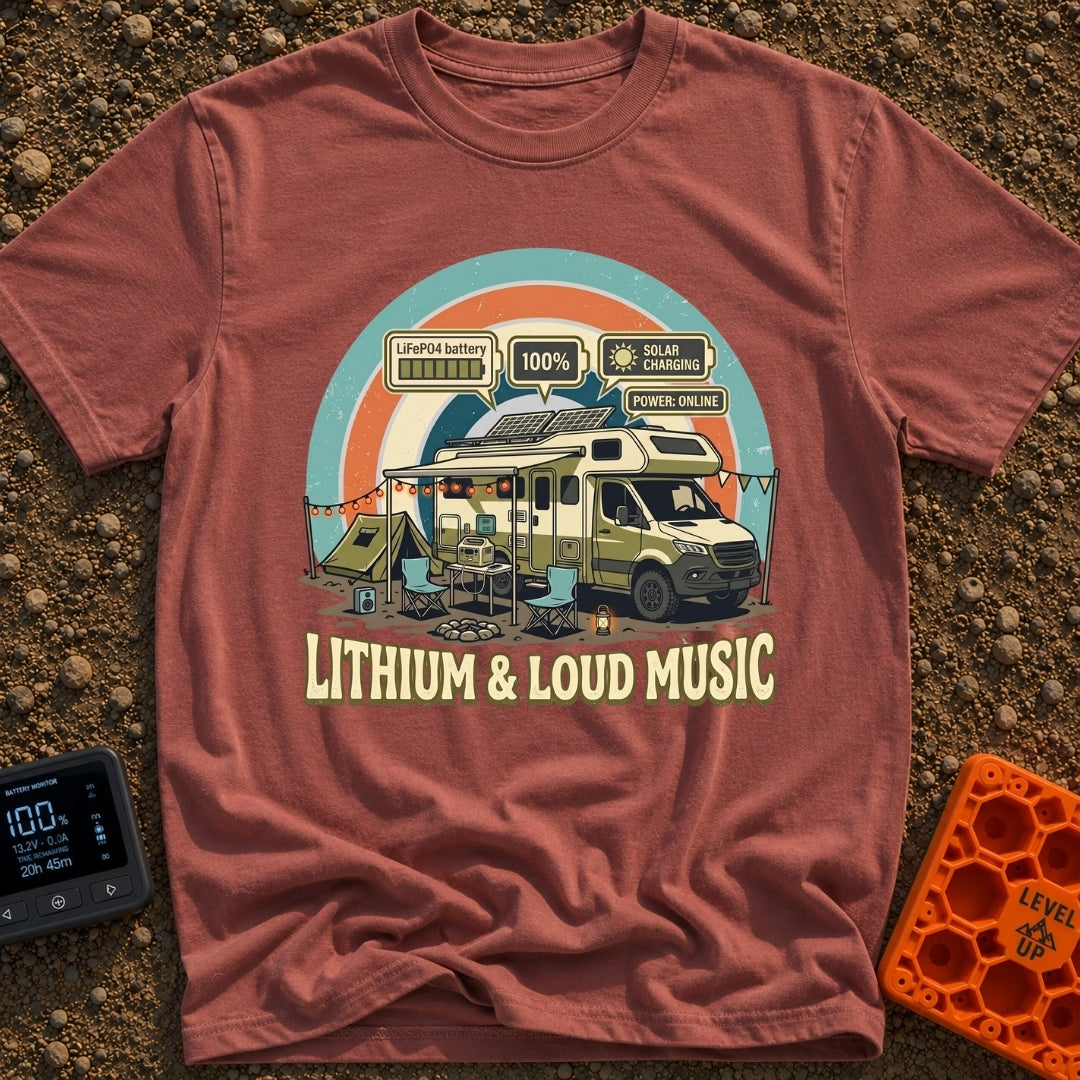 Lithium and Loud Music - T-Shirt in Brick - An RV is parked at a campsite featuring an open awning with string lights, a...