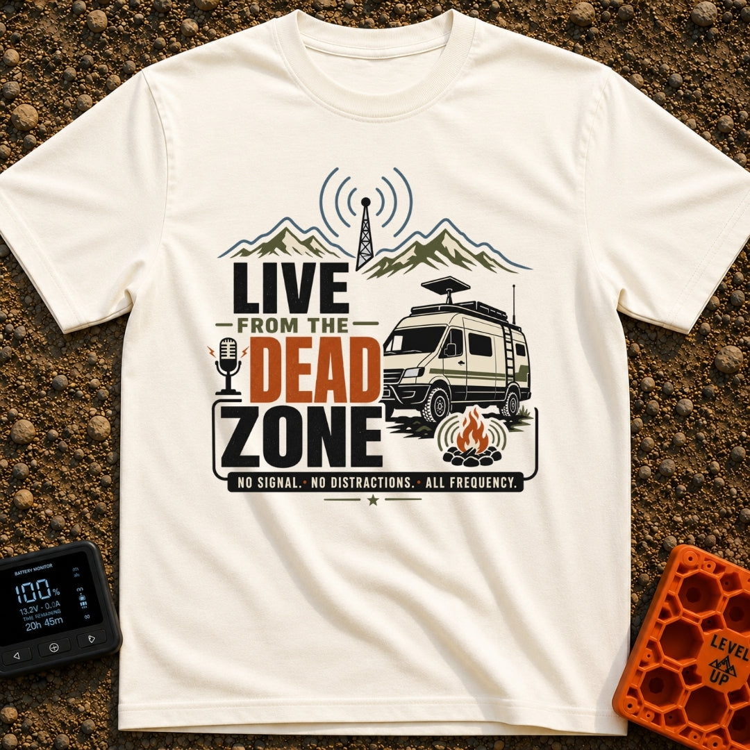 Dead Zone Live - T-Shirt in Ivory - A graphic featuring an off-road camper van parked near a campfire with mountains and...