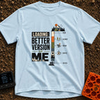 Better Version Loading - T-Shirt in Chambray - A graphic reading "LOADING: BETTER VERSION OF ME" next to a vertical...