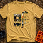 Better Version Loading - T-Shirt in Mustard - A graphic reading "LOADING: BETTER VERSION OF ME" next to a vertical...