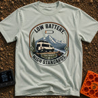 Low Battery High Standards - T-Shirt in Bay - A badge-style graphic featuring a white camper van parked on a dirt...