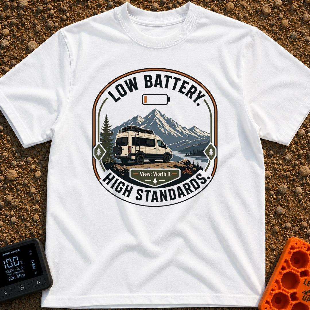 Low Battery High Standards - T-Shirt in White - A badge-style graphic featuring a white camper van parked on a dirt...