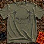 Low Power Mode - T-Shirt in Moss - A black-and-white line illustration of a hammock strung between two pine trees in...