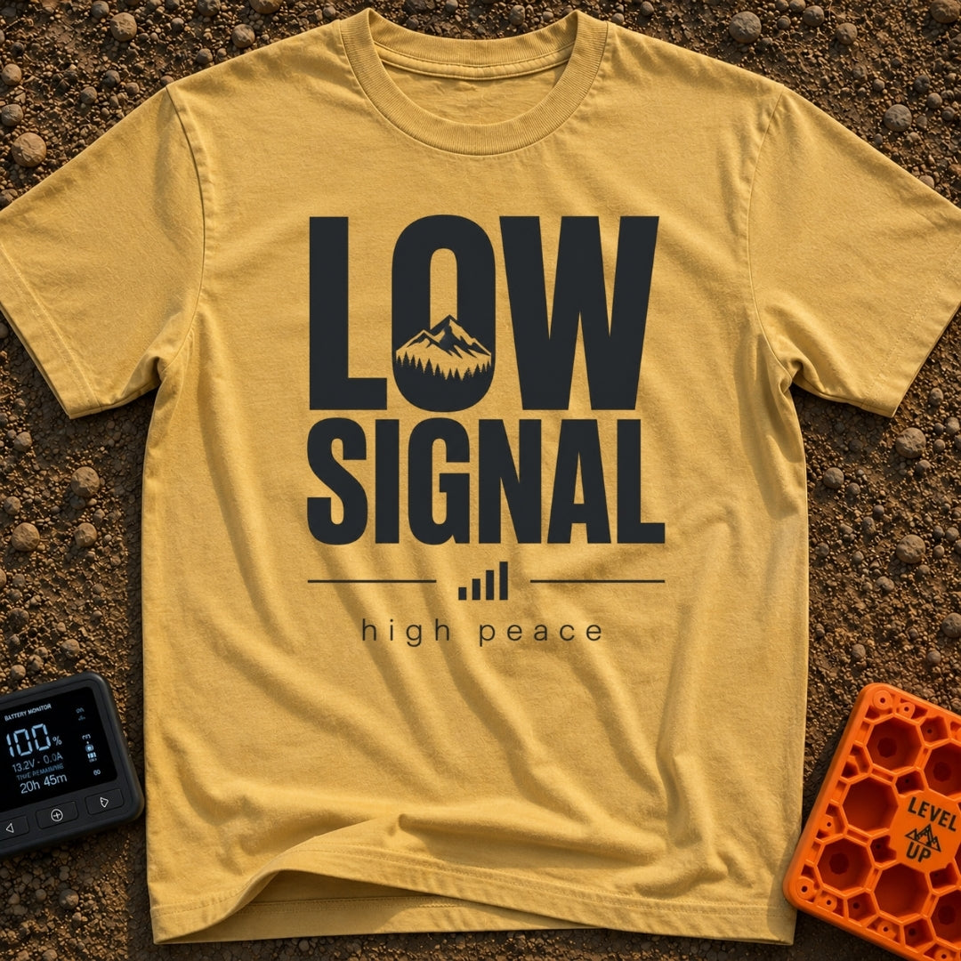No Signal No Problem - T-Shirt in Mustard - The design features the words "LOW SIGNAL" in large, bold typography, with a...