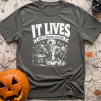 The Mad Roaster - T-Shirt in Pepper - A white line drawing of a mad scientist using jumper cables attached to a 12-volt...