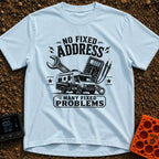 Fixed For Now - T-Shirt in Chambray - A black and white illustration of a Class C motorhome positioned in front of a...