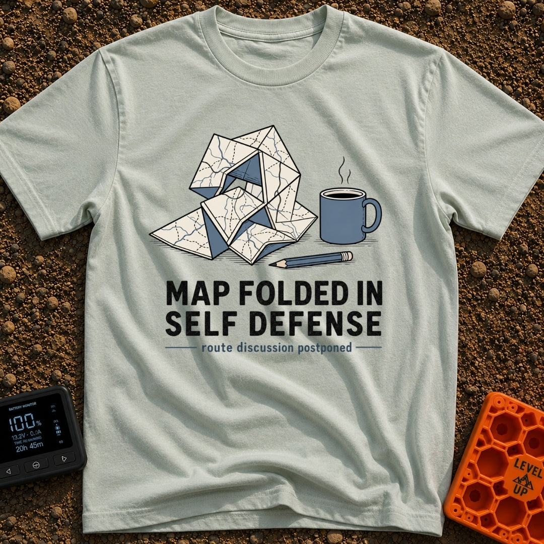 Map Ninja Skills - T-Shirt in Bay - An illustration of a paper map folded chaotically into a tangled geometric shape,...