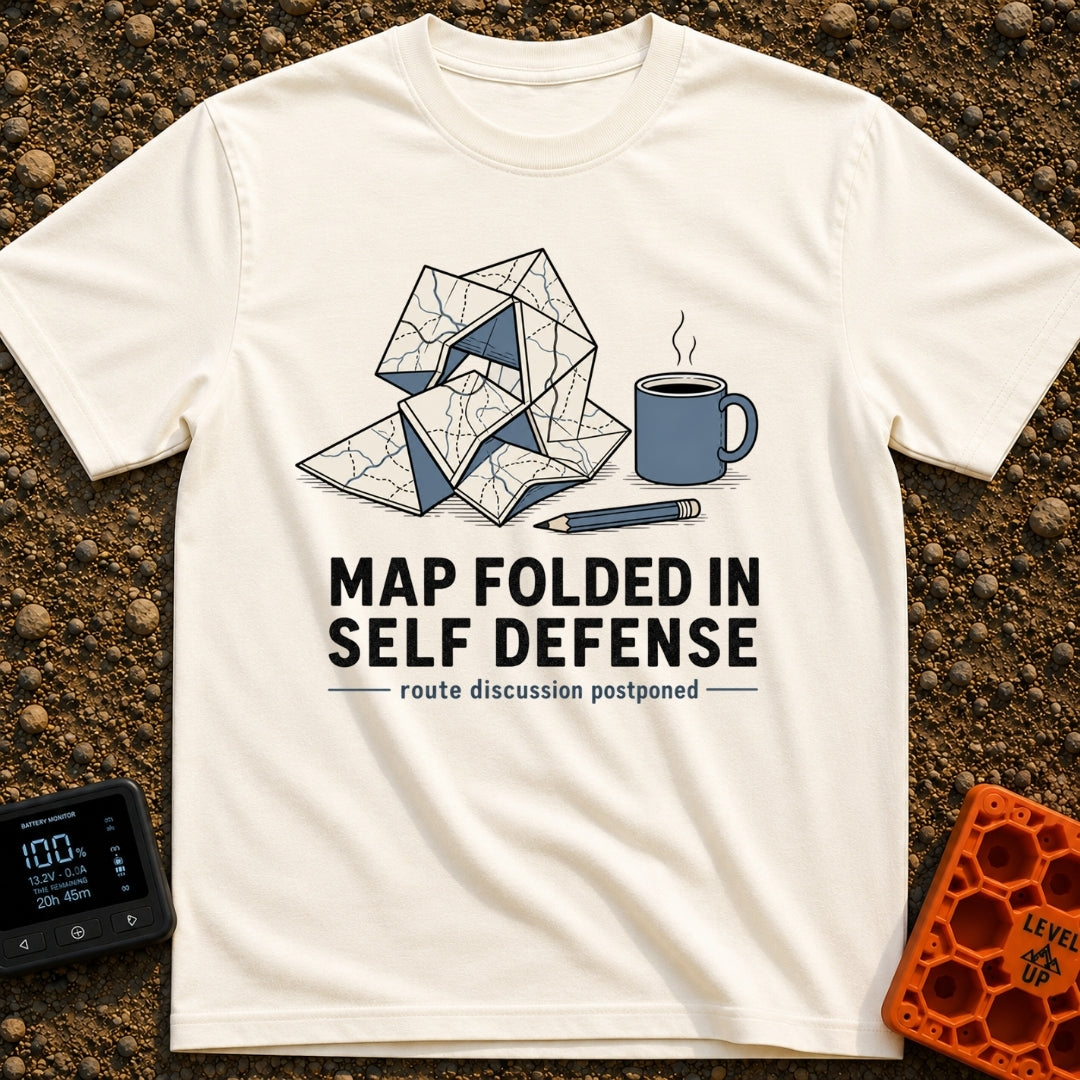 Map Ninja Skills - T-Shirt in Ivory - An illustration of a paper map folded chaotically into a tangled geometric shape,...