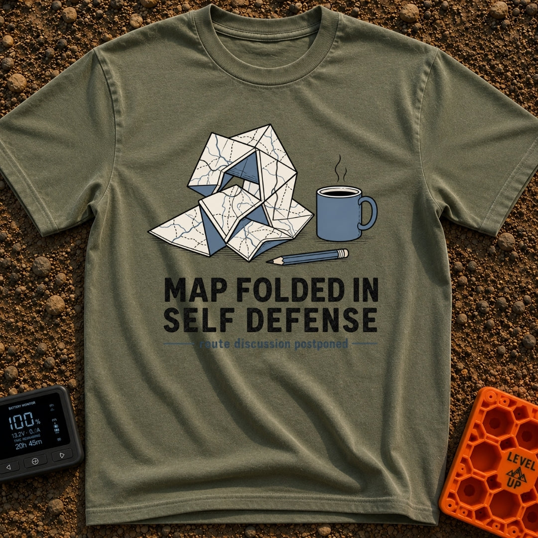 Map Ninja Skills - T-Shirt in Moss - An illustration of a paper map folded chaotically into a tangled geometric shape,...