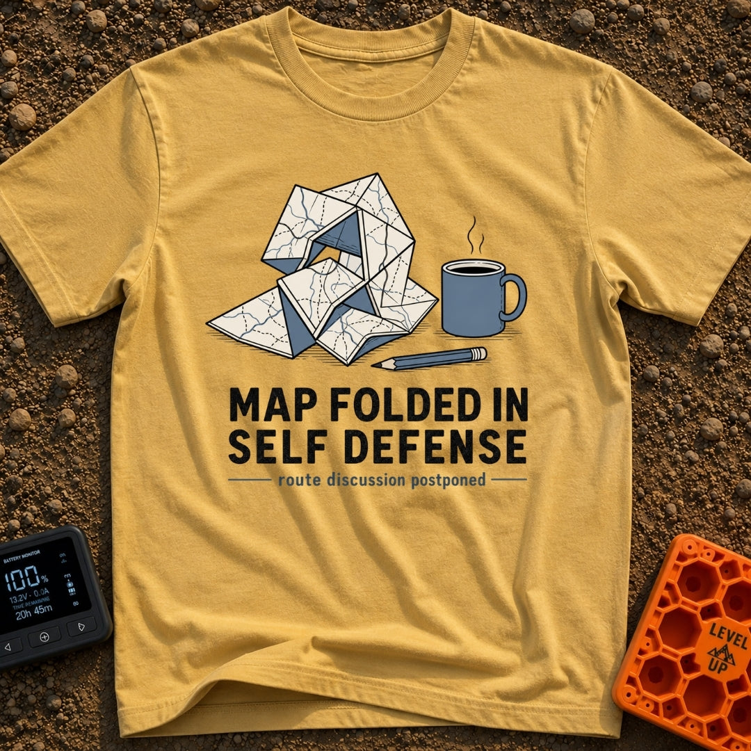 Map Ninja Skills - T-Shirt in Mustard - An illustration of a paper map folded chaotically into a tangled geometric shape,...