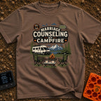 Campfire Marriage Counseling - T-Shirt in Espresso - A white camper van parked by a mountain lake, with two empty camp...