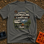 Campfire Marriage Counseling - T-Shirt in Pepper - A white camper van parked by a mountain lake, with two empty camp...
