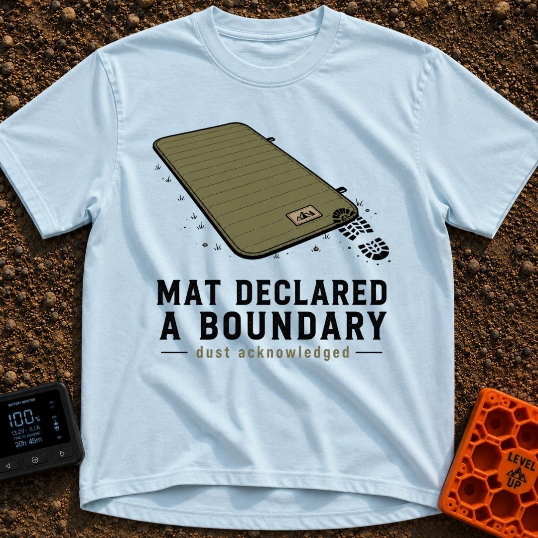 Boundary Mat Mischief - T-Shirt in Chambray - An illustration of an olive green quilted camping mat lying on dirt and...