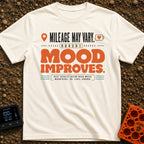 Mileage May Improve Mood - T-Shirt in Ivory - A typographical design with the text 'Mileage May Vary' and 'Mood Improves'...