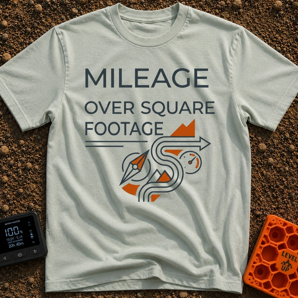 Miles Over Square Feet - T-Shirt in Bay - The design features the text "MILEAGE OVER SQUARE FOOTAGE" above a line-art...