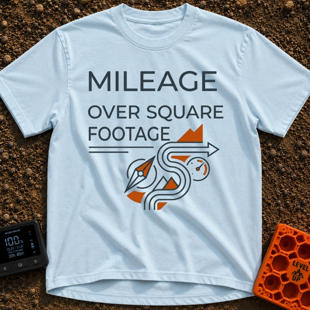 Miles Over Square Feet - T-Shirt in Chambray - The design features the text "MILEAGE OVER SQUARE FOOTAGE" above a...