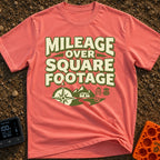 Miles Over Space - T-Shirt in Watermelon - The design features the text "MILEAGE OVER SQUARE FOOTAGE" stacked above a...