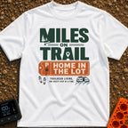Trail Miles Lot Life - T-Shirt in White - A graphic design with the text "Miles On Trail, Home In The Lot" alongside...
