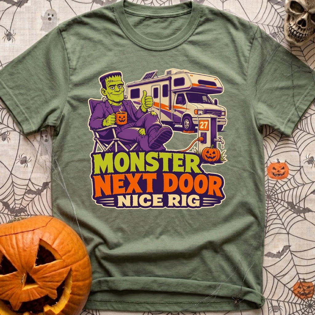 Monster Says Nice Rig - T-Shirt in Moss - A cartoon illustration of Frankenstein's monster sitting in a camp chair giving...