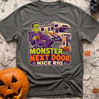 Monster Says Nice Rig - T-Shirt in Pepper - A cartoon illustration of Frankenstein's monster sitting in a camp chair...