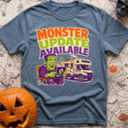 Beast Update Pending - T-Shirt in Blue Jean - A cartoon illustration of Frankenstein's monster sitting in a camp chair,...
