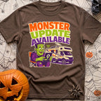 Beast Update Pending - T-Shirt in Espresso - A cartoon illustration of Frankenstein's monster sitting in a camp chair,...